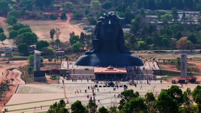 Close up shot of magnificent Adiyogi Shiva statue in Isha Foundation with people and trees at Chikkaballapur, Bangalore, karnataka, india. day time, slight push in shot, drone shot, 4k.