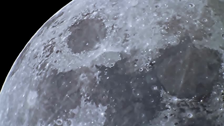 Detailed extreme close-up view of the moon surface showcasing craters and textures