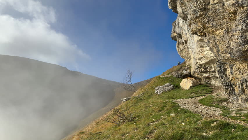 Hiking to the top of Jura Mountains on sunny day. Static