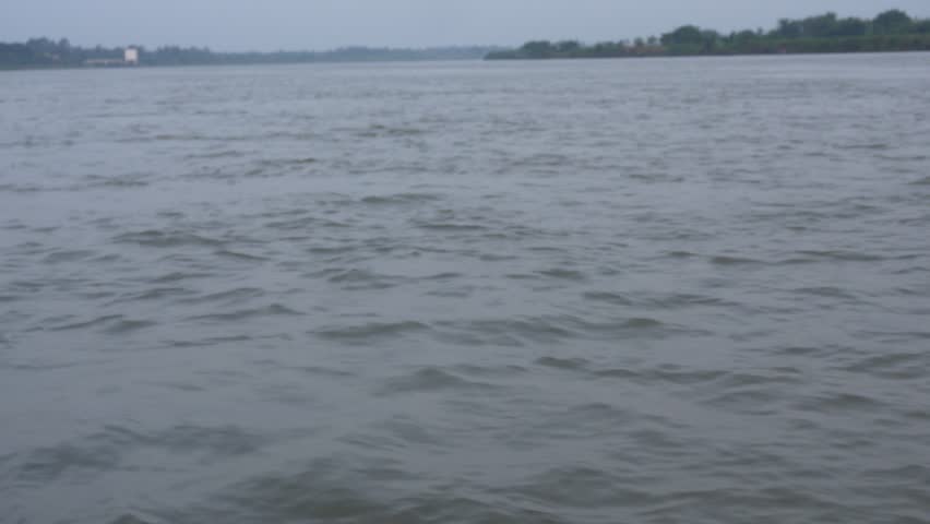Rippling Water with Distant Shoreline Buildings