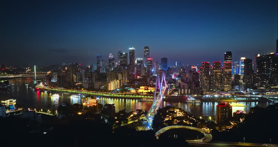 Aerial view of the Chongqing skyline and the Yangtze River bridge at night, China
