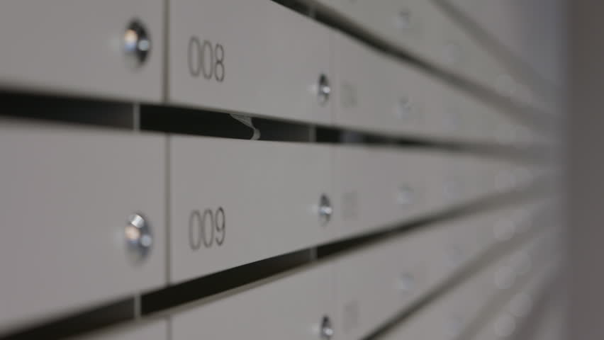 Residential mailbox row in modern apartment building lobby
