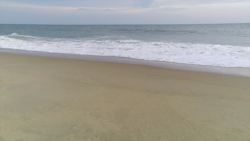 Surf washes up on an Atlantic coast beach.