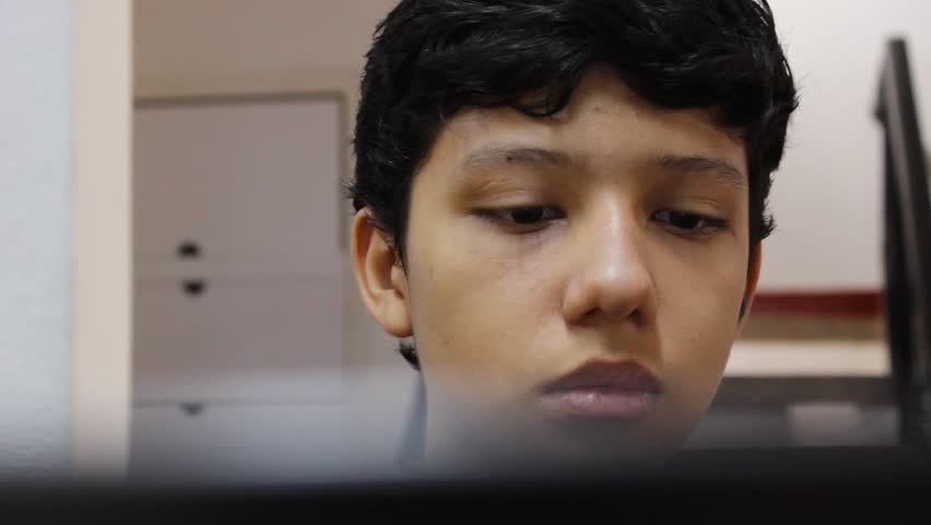 Portrait of a Colombian teenager working on a robotics project using a laptop in a laboratory in Neiva, Huila, Colombia. Concept of education and technology