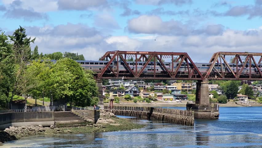 Train crossing Salmon Bay Bridge over the waterway in Seattle, Washington.