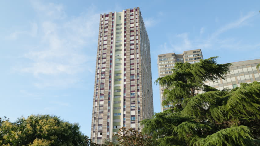 Tall Modernist High Rise Skyscraper Building Framed by Green Trees at Front de Seine Beaugrenelle Paris