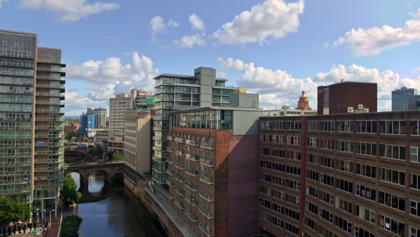 Panoramic aerial view of the city of Manchester showing modern and old architecture on a sunny day