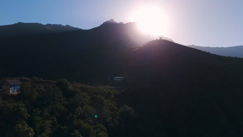 Aerial view Mount Khustup in Syuniq province, Armenia. People are hiking up a mountain to reach the summit. The sun is rising, and the landscape shows vast mountains and valleys. The air is clear and fresh. Touristic place.