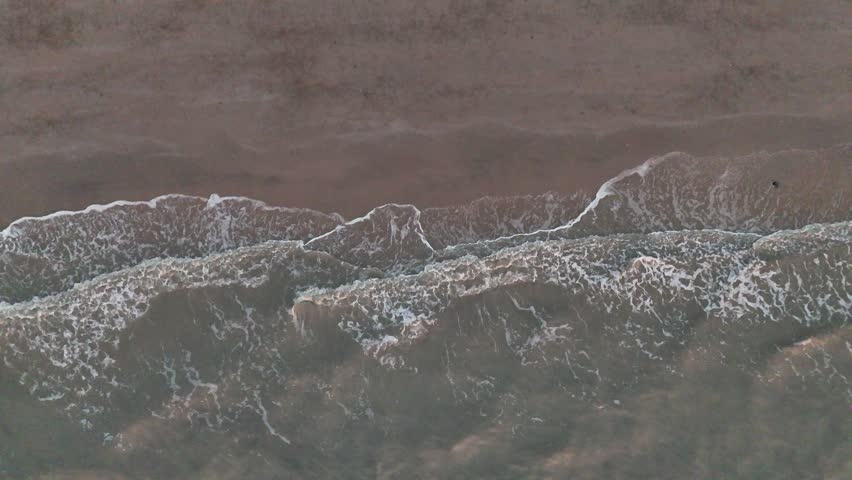  close up view of the textured surface of a frozen lake in winter.