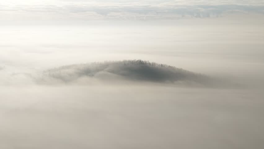 High angle view of a hill above the clouds