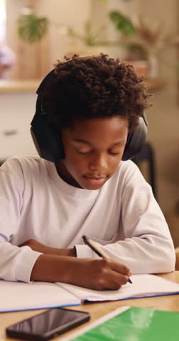 Writing, headphones and child with book for education, homework and practice mathematics in home. Study, notebook and kid with tech for lesson tips, development or productivity with audio assessment