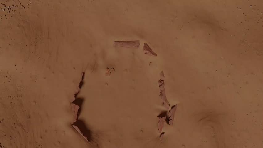 Top view 3D animation loop of futuristic spaceships landing on the red desert surface of planet Mars. Sci-fi concept of space colonization, rocket landing mission, and planetary exploration.