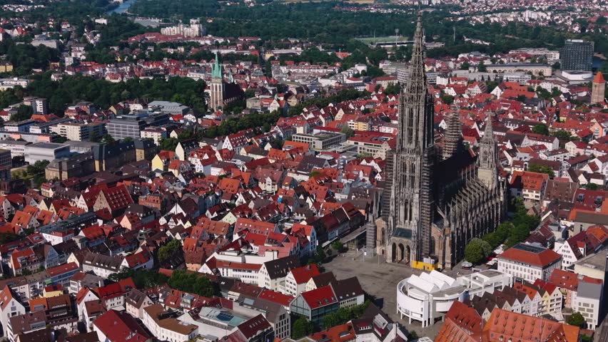 Aerial view around the old town and münster cathedral of the city Ulm in Germany on a sunny summer noon.