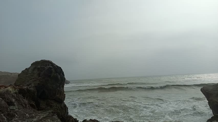 Waves crashing on rock shores