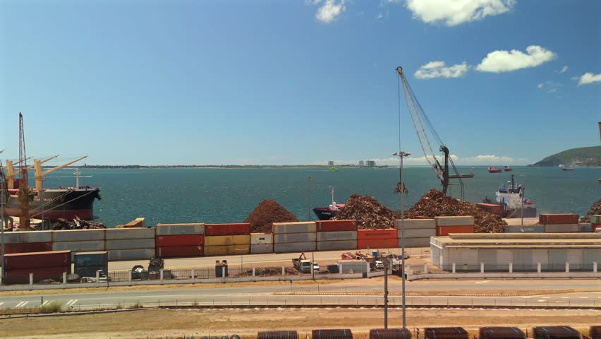 Cargo Ships Moored at Loading Docks in Industrial Seaport