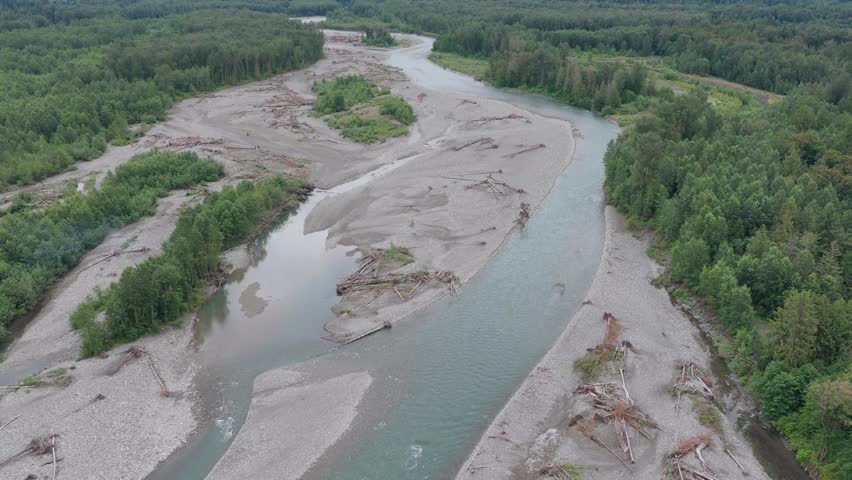 Aerial View of the Majestic Chilliwack River Winding Through Forests and Mountains in British Columbia, Canada