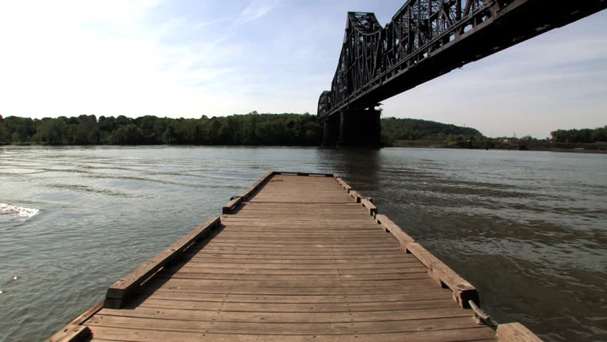 A dock rocks up and down on the Ohio River.