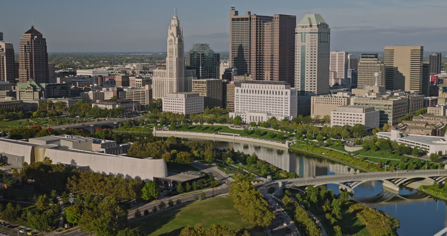 Columbus Ohio Aerial v22 tracking flyover COSI building and Veterans museum along the bend of Scioto River, overlooking at riverfront downtown cityscape - Shot with Inspire 3 8k - Sept 21st 2023