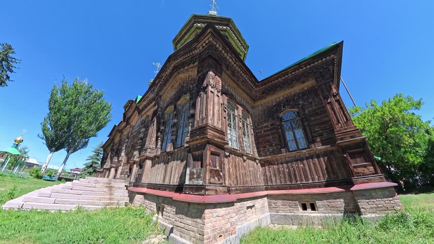 Ancient Russian Orthodox Wooden Church In Karakol Kyrgyzstan With Upward Camera Movement 4K Video

