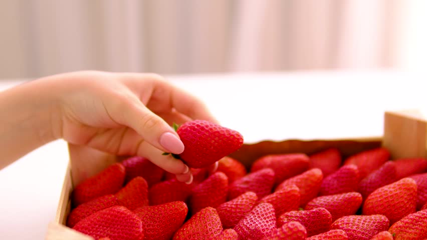 Fresh organic strawberries in wooden box. strawberries in a wooden box