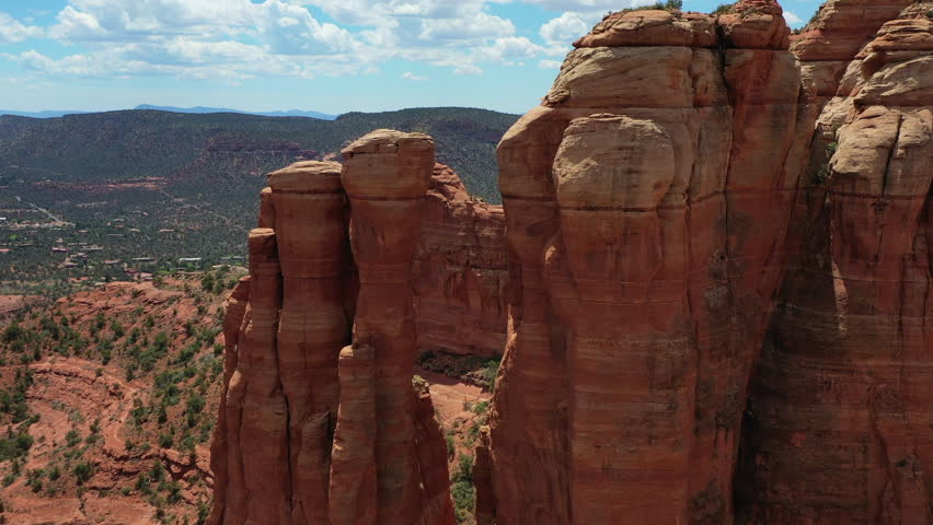 Cinematic Drone Flight Between Massive Red Rocks in Sedona Arizona