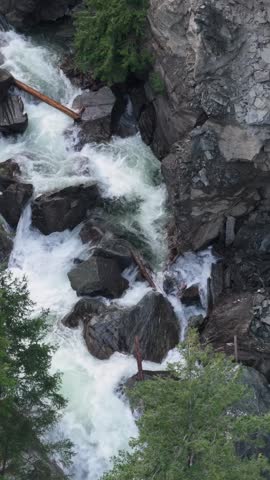 Powerful Waterfall Cascading Down Rocky Terrain in British Columbia, Canada