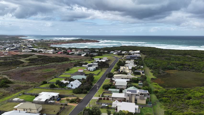 Peterborough, Victoria, Australia – 4K Aerial Drone Footage of coastal town along Great Ocean Road and Bay of Martyrs, Coastal Townscape and Scenic Coastline. 