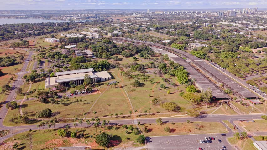 Aerial drone view of the long Instituto Central de Ciências (ICC), known as Minhocão, at the University of Brasília (UnB) campus, with Paranoá Lake.
