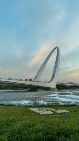 Sunset scenery over the Yongding River at the new Shougang Bridge in Beijing, China.