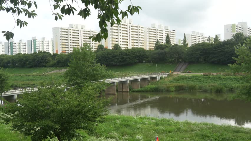 A small bridge crossing a city stream