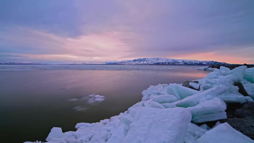Winter Sunset Timelapse over Frozen Lake and Mountains