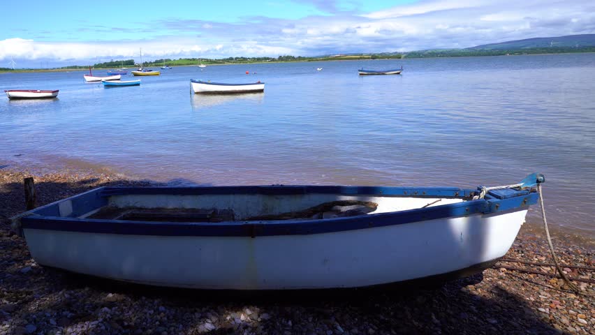 Gentle fishing boat scene with cloud