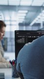 System administrator protects firewall misconfiguration at a technical workstation, linking cybersecurity work, network defense and data protection from camera B angle. - Powered by Shutterstock - Get 15% off with code: PIKWIZARD15
