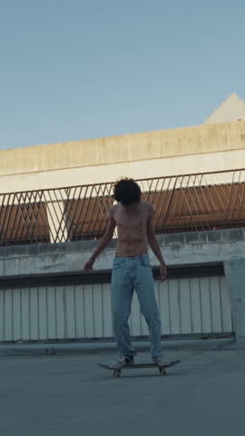A young skateboarder performs a trick on a concrete ramp in an urban setting, symbolizing adolescence and youth culture. Showing a carefree lifestyle, enhanced by a dramatic flare of sunlight.