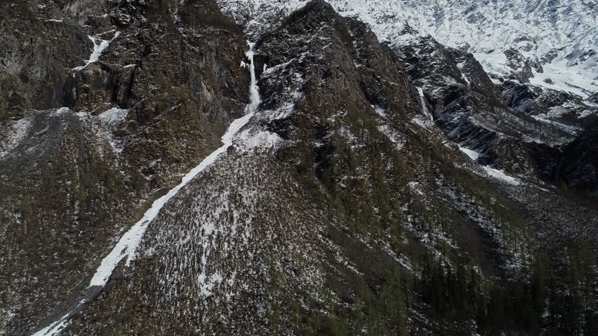 Aerial footage landscape of foggy snow capped mountains in sichuan, China