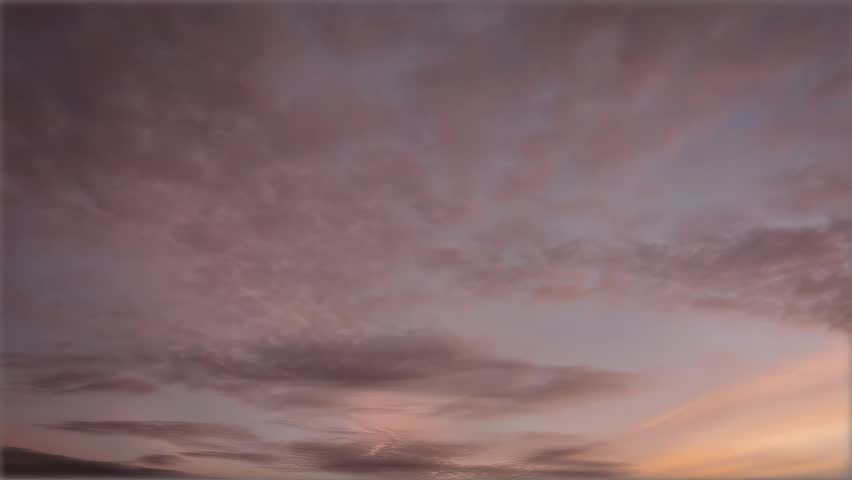 Dramatic clouds during golden hour sunset in the sky