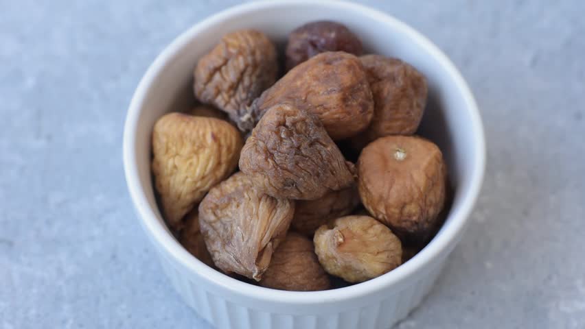 Dried fig are a sweet, healthy fruit for vegans and vegetarians. Dried fig as a food background