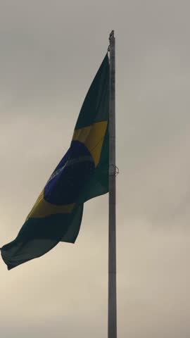 Brazilian Flag waving in the sky. Brazil.