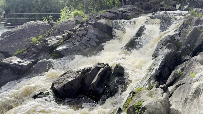 Scenic Northern Waterfall Flowing Through Rocky Forest Landscape in Karelia