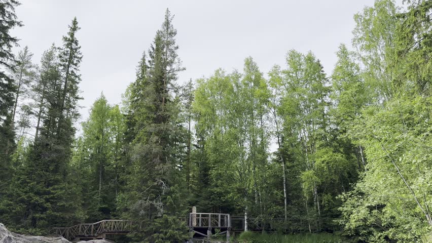 Scenic Northern Waterfall Flowing Through Rocky Forest Landscape in Karelia