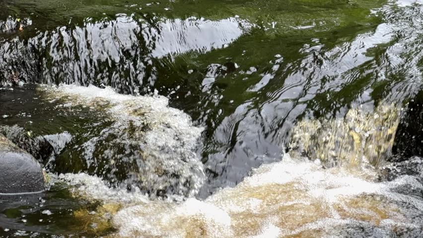 Scenic Northern Waterfall Flowing Through Rocky Forest Landscape in Karelia