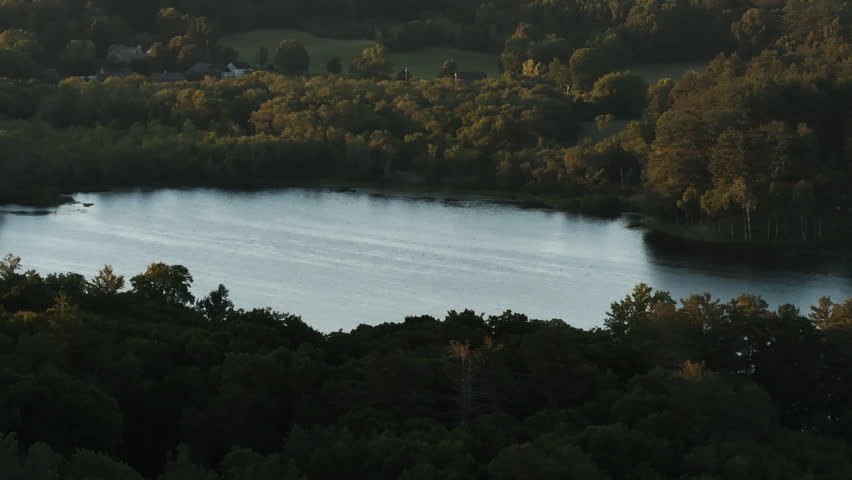 Establishing shot of a lake in rural Connecticut. Shot on a summer day in New England.