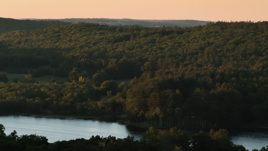 Establishing shot of a lake in rural Connecticut. Shot on a summer day in New England.