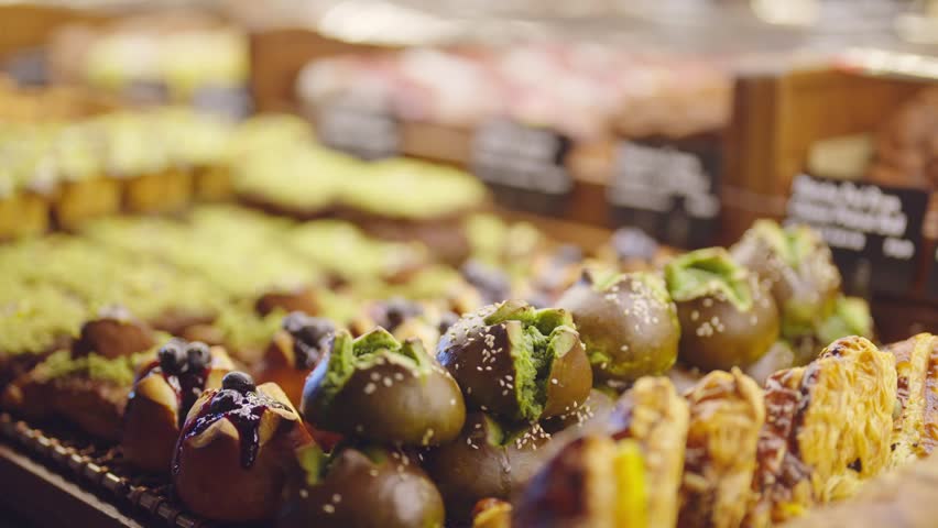Traditional chinese sweets in food market, closeup view, enjoy tasty desserts. Snacks and delicatessen on showcase in street food restaurants, delicious meals, taste unusual asian food when traveling