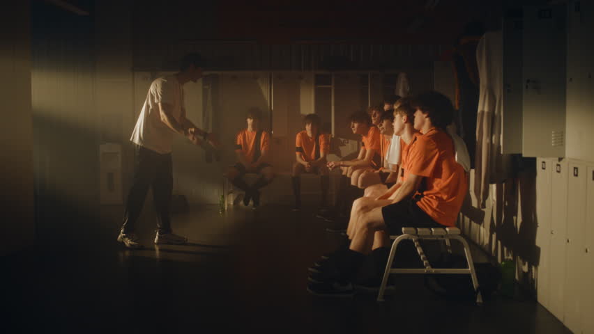 Professional Coach Reprimands Teenage Football Team For Mistakes During Training. Diverse Players Dejected, But One Angry Athlete Openly Argues Back Storms Out. Raw Human Emotions in Youth Sports.