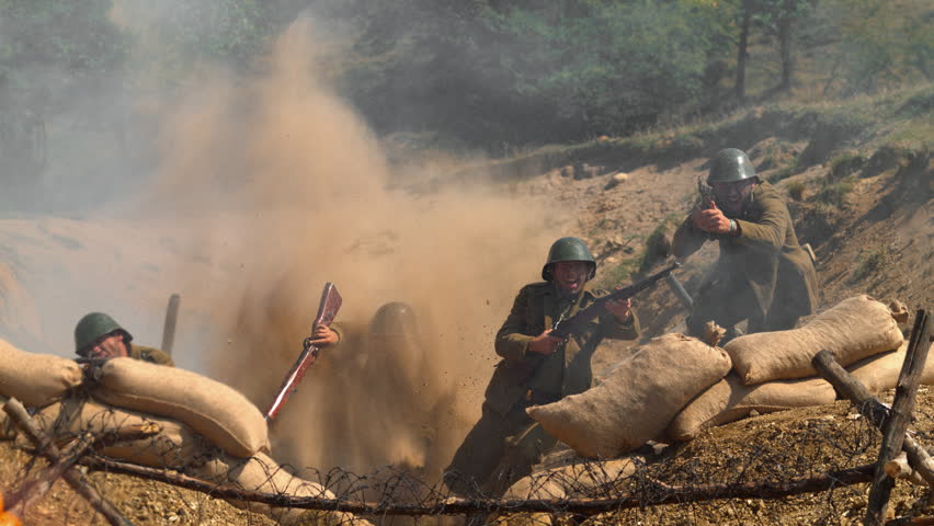 Historical military reenactment showing soldiers in a defensive trench position