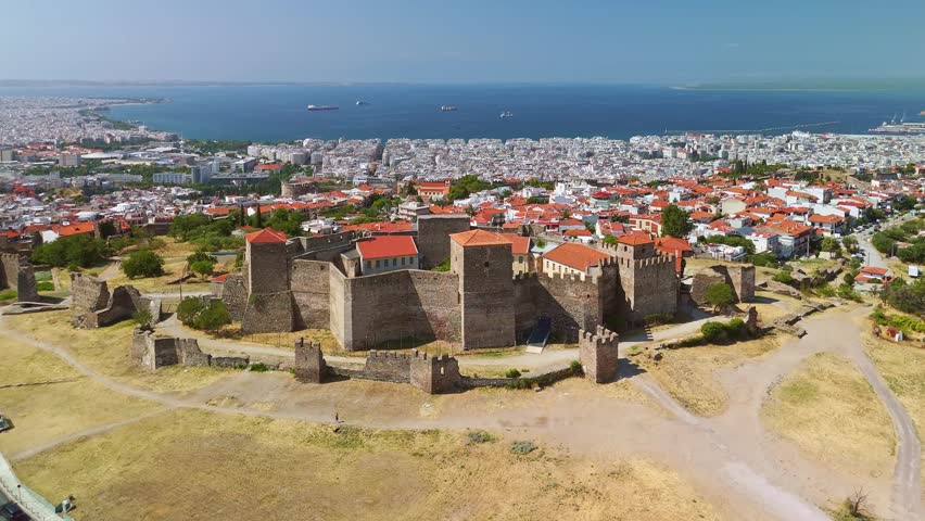Aerial view of the Heptapyrgion Yedi Kule fortress towers and the historic Ano Poli district overlooking the sea in Thessaloniki, Greece