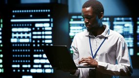 African American computer scientist supports AI computing in a data center, connecting artificial intelligence during tablet analyze servers. - Powered by Shutterstock - Get 15% off with code: PIKWIZARD15