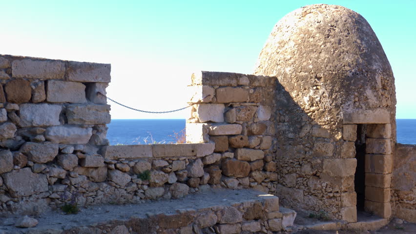 Historic stone walls and watchtower of Rethymno Fortezza in Crete, Greece