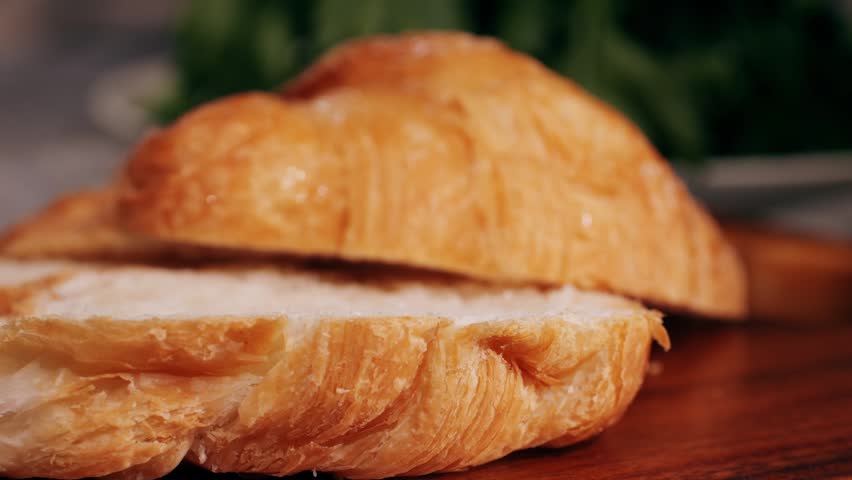  Croissant with jamon ham, Salmon, in Modern Cafe, Top View of Healthy Breakfast in Cafe. English breakfast: fried egg, bacon toast on sandwich.